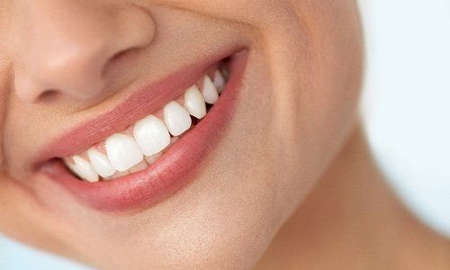 Closeup of woman with white teeth smiling