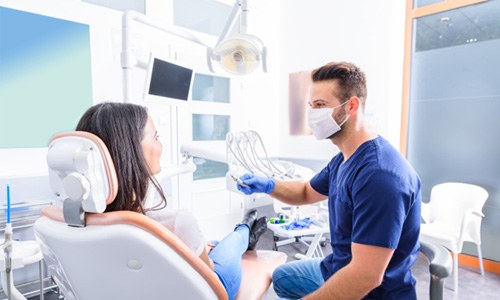 a patient during her dental checkup in Webster