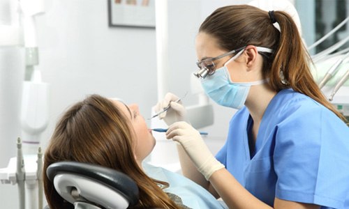 a patient having her teeth cleaned in Webster