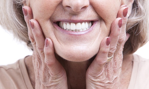 Closeup of smiling woman with dentures in Webster