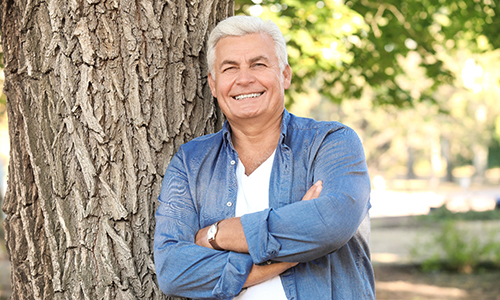 Man with dentures in Webster smiling