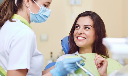 Woman smiling after getting a tooth-colored filling in Webster 