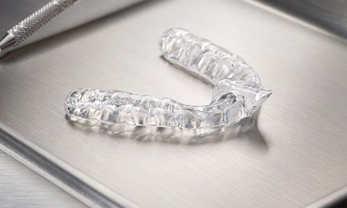 Clear nightguard for bruxism on metal tray