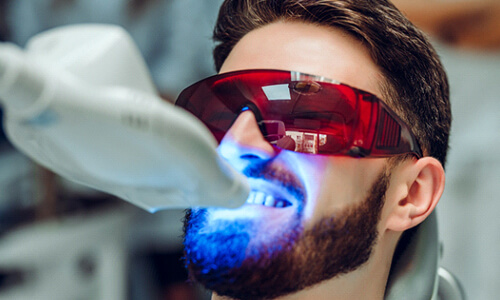 Patient getting in-office teeth whitening in Webster