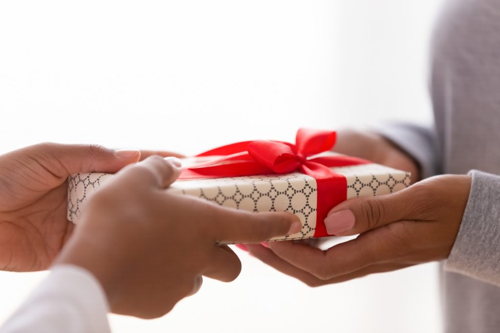 Friend giving a perfectly wrapped gift