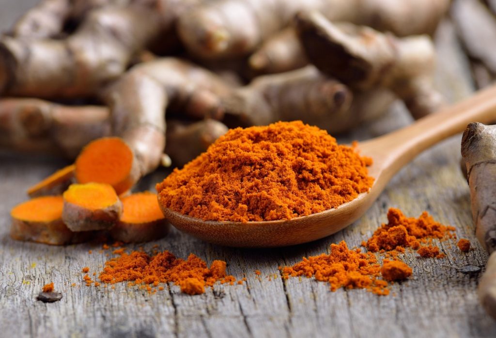 Closeup of turmeric on spoon