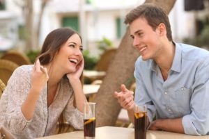 a couple smiling while on a date 