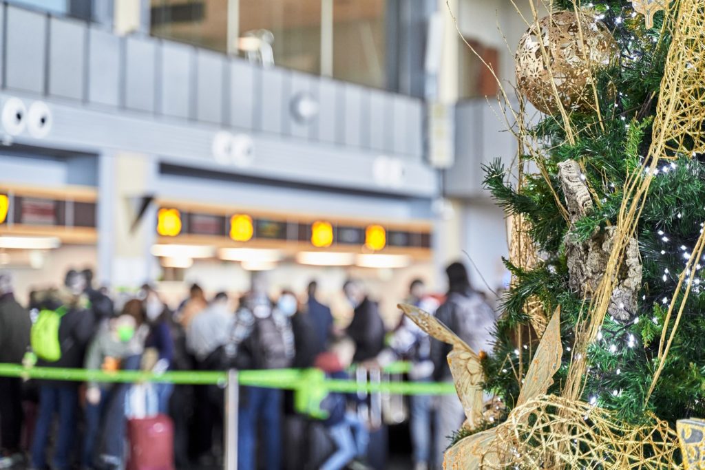 Airport with long lines decorated for the holidays